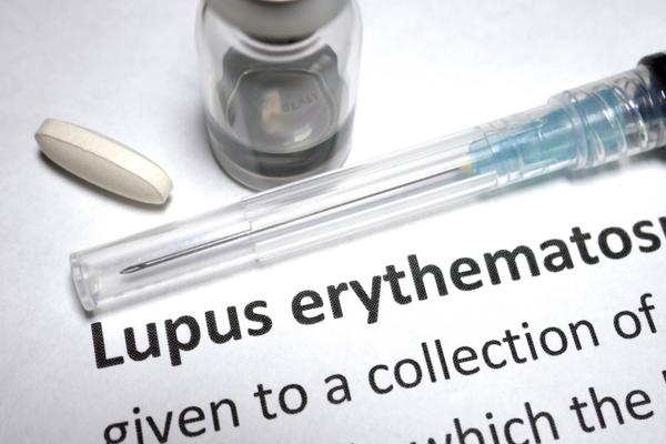 A syringe and text describing lupus