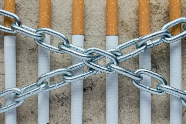 An image of cigarettes and chains, symbolizing nicotine dependence