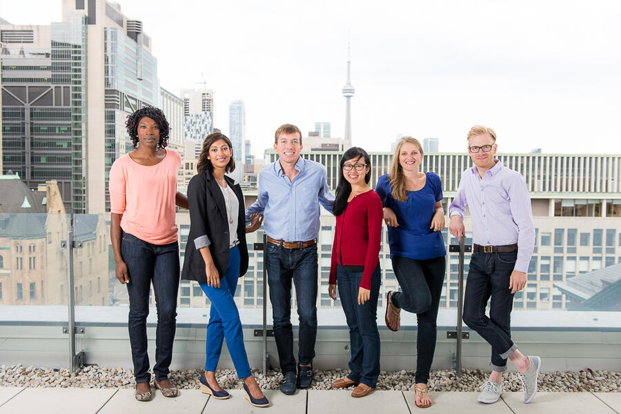 Residents posing in front of Toronto skyline