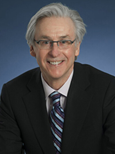 A portrait photo of Dr. Alastair Flint