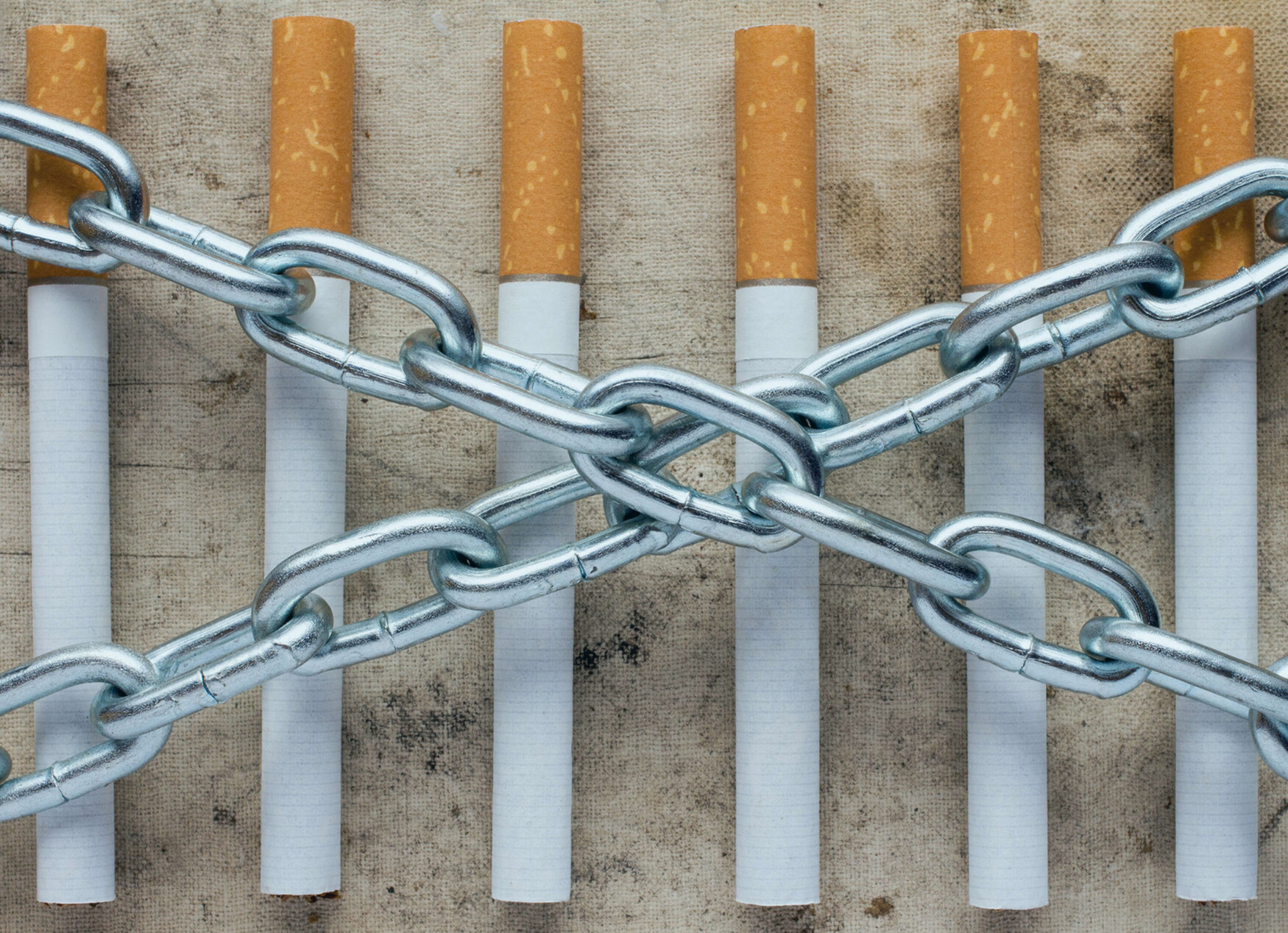 An image of cigarettes and chains, symbolizing nicotine dependence